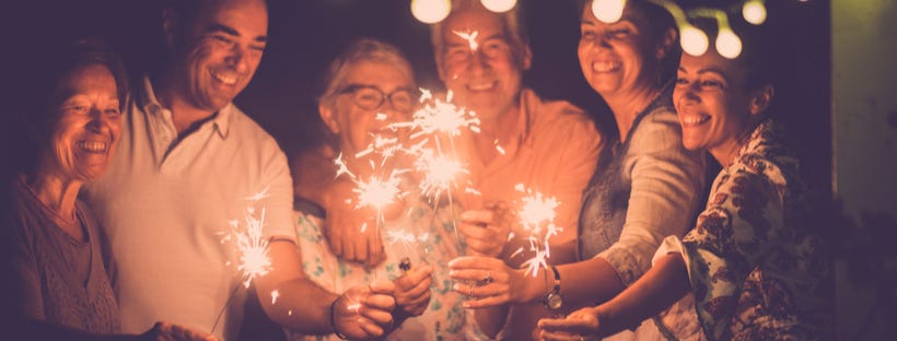 Party guests holding sparklers