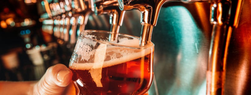 Bartender pouring a pint of beer