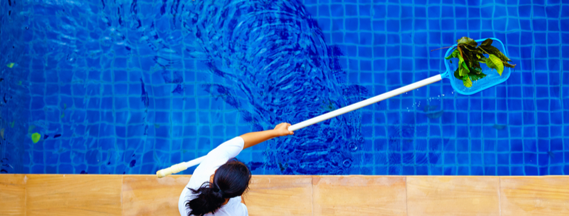 Woman cleaning pool