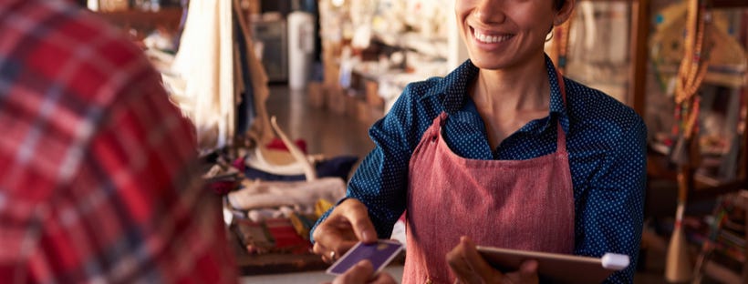 Sales assistant receiving credit card